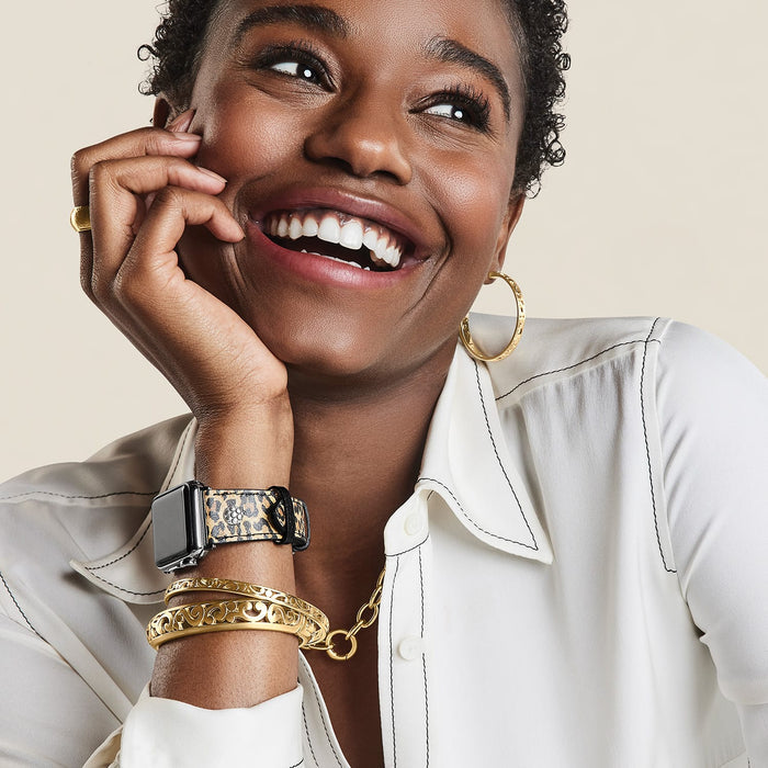 Model wearing a Brighton leopard print leather watch band with silver-plated accent and coordinating Brighton accessories