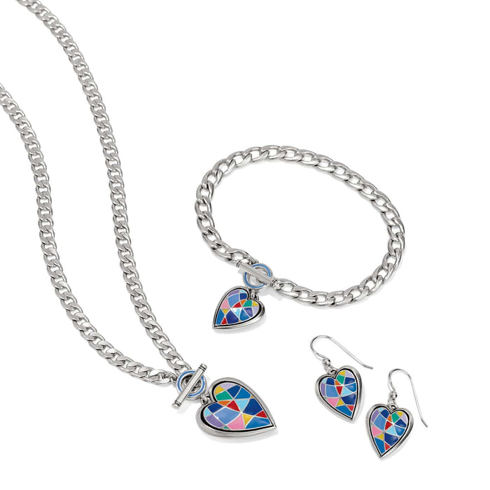 Brighton silver-plated jewelry set styled with curb chain necklace, bracelet, and earrings featuring colorful enamel heart charms