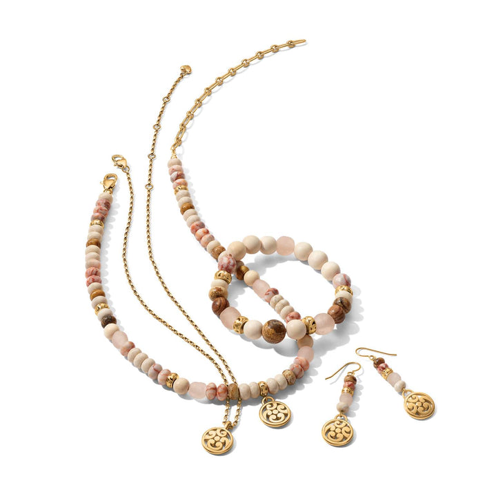 Brighton jewelry set with white howlite, picture jasper, rose glass, red silk web jasper beads, gold-plated medallions on white background