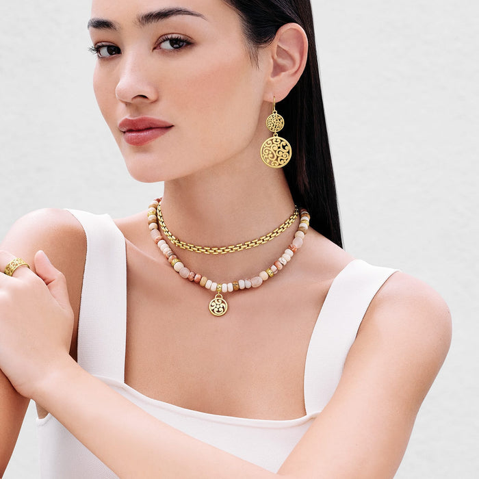 Model wearing a Brighton gold-plated beaded pendant necklace with jasper and howlite beads, coordinating Brighton accessories