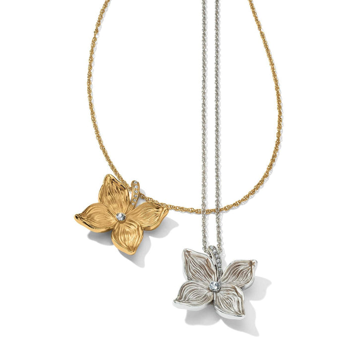 Brighton floral pendant necklaces in gold-plated and silver-plated finishes with crystal centers on a white background