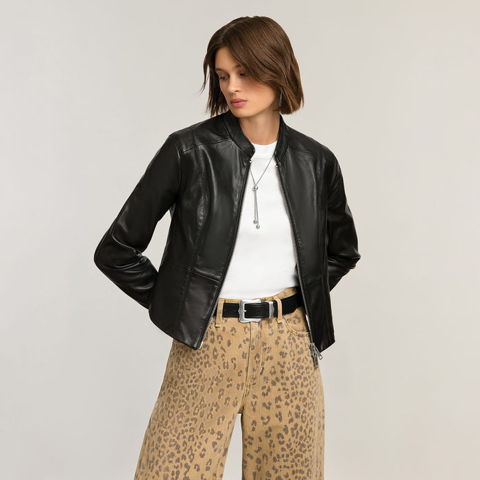 Model wearing a Brighton black leather jacket with zip front and stand collar, styled with coordinating Brighton accessories