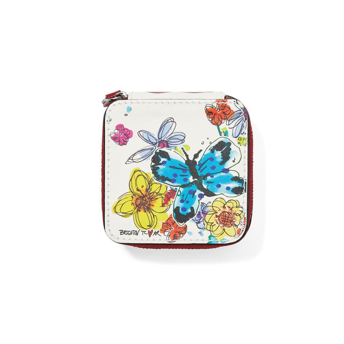 Brighton leather zip case with floral and blue butterfly print and red trim on a white background