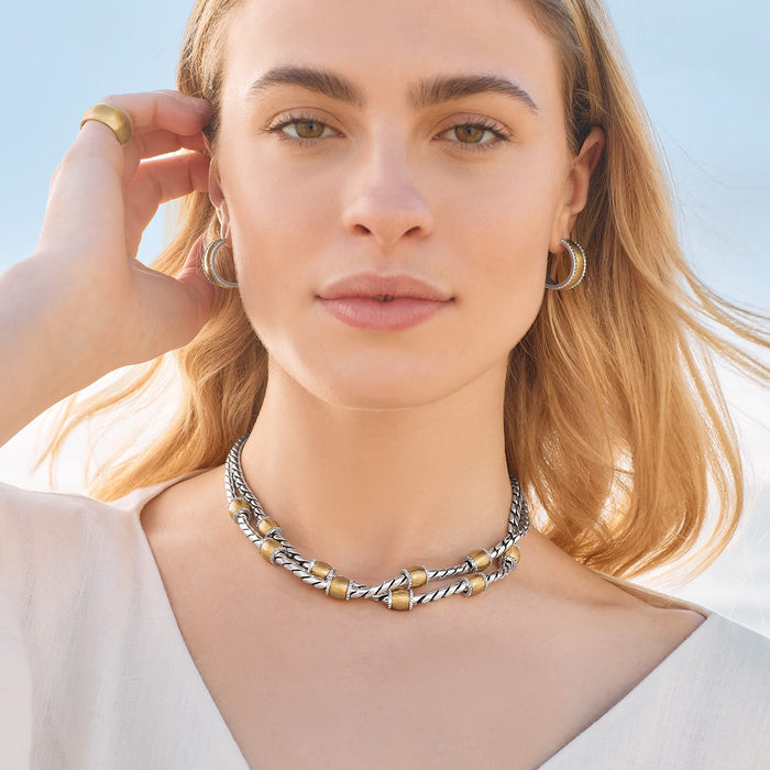 Model wearing a Brighton two-strand necklace with gold-plated beads, crystal accents, and coordinating Brighton accessories