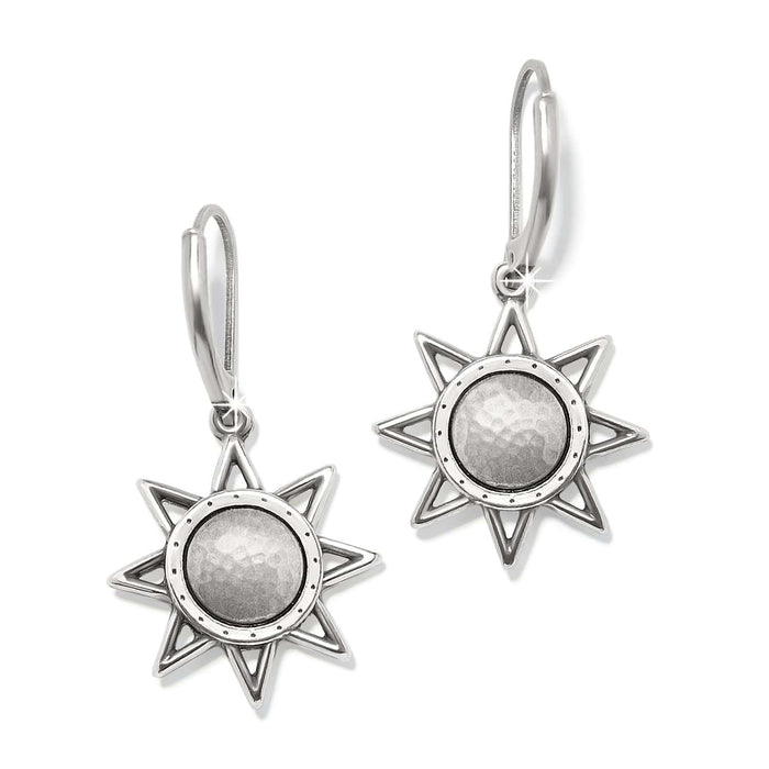 Brighton drop earrings with silver-plated eight-point star design and hammered round centers on a white background