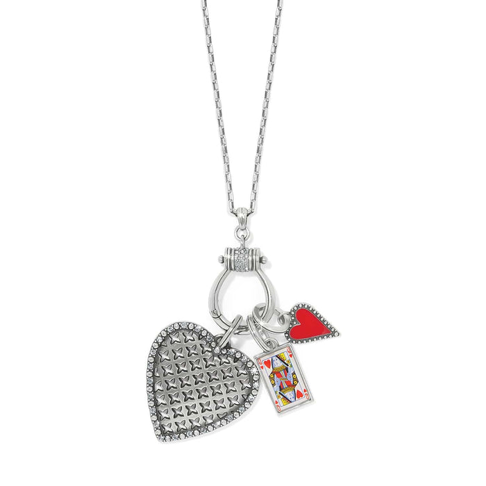 Brighton charm necklace with silver-plated heart pendant, queen of hearts card charm, and red heart on a white background