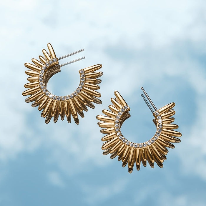 Brighton hoop earrings with gold-plated sunburst spikes and crystal-lined inner edge on a white background
