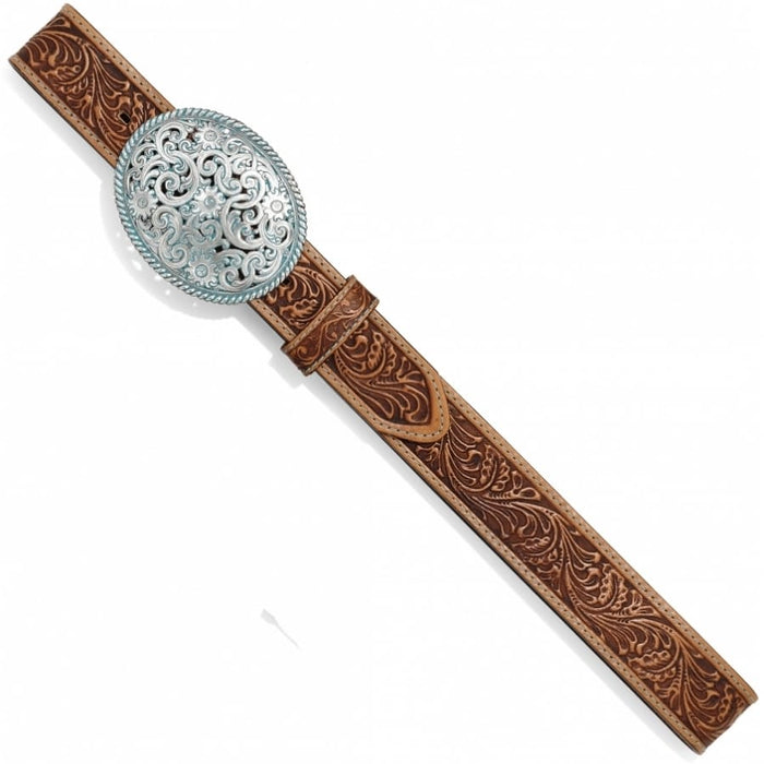 Brighton tooled brown leather belt with ornate round silver-tone scrollwork buckle on a white background