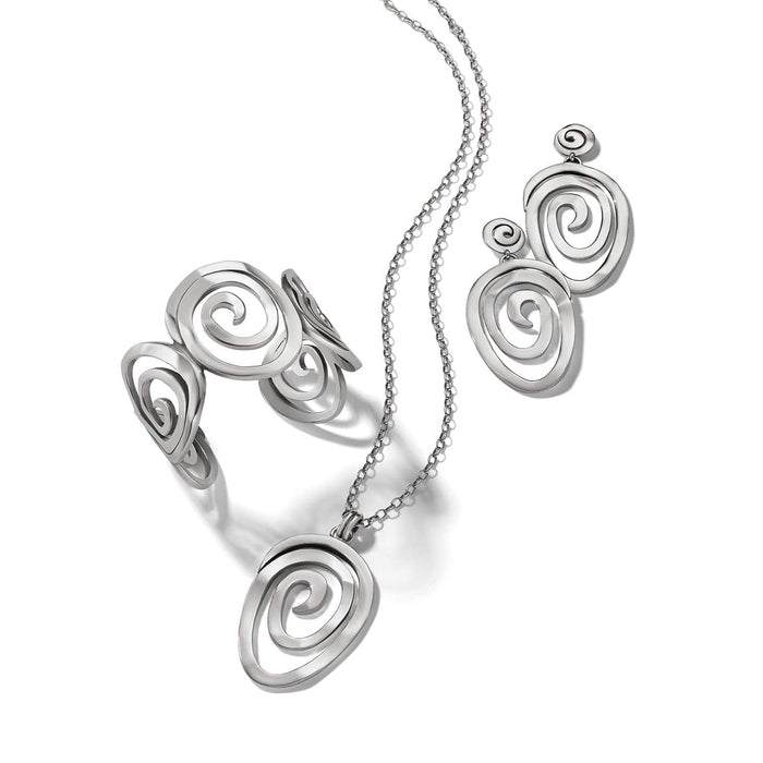 Brighton silver-plated jewelry set styled with matching spiral-design pendant necklace, cuff bracelet, and drop earrings on white background