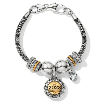 Brighton charm bracelet with two-tone beads, crystal accents, and 2023 medallion charm on a white background