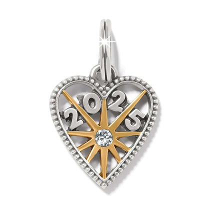 Brighton heart charm with two-tone finish, gold starburst, crystal center, and 2025 numerals on a white background