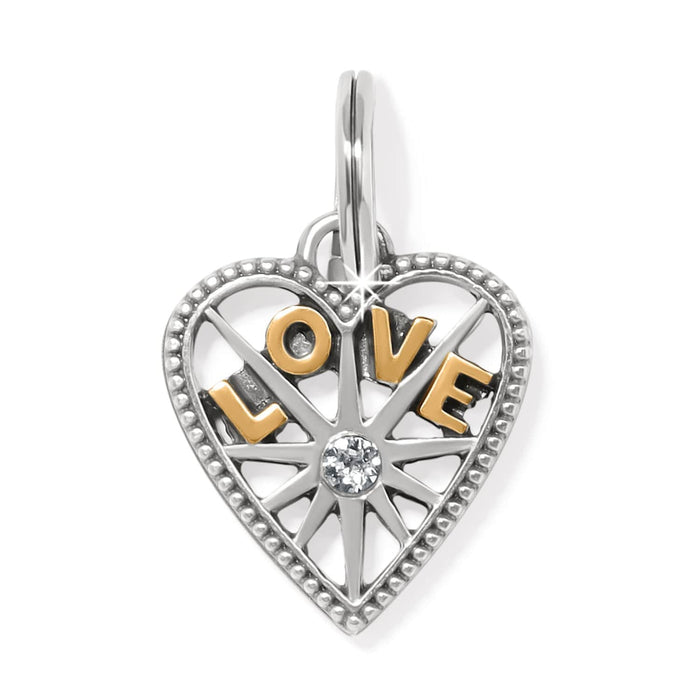 Brighton heart charm with gold-tone LOVE letters, crystal center, and beaded silver-tone border on a white background