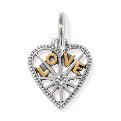Brighton heart charm with gold-tone LOVE letters, crystal center, and beaded silver-tone border on a white background