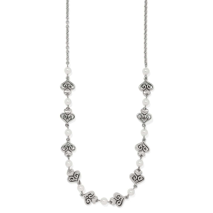 Brighton silver-plated necklace with ornate scroll heart links and glass pearl accents on a white background