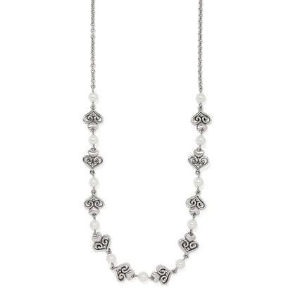 Brighton silver-plated necklace with ornate scroll heart links and glass pearl accents on a white background