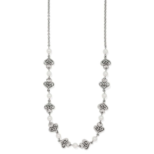Brighton silver-plated necklace with ornate scroll heart links and glass pearl accents on a white background