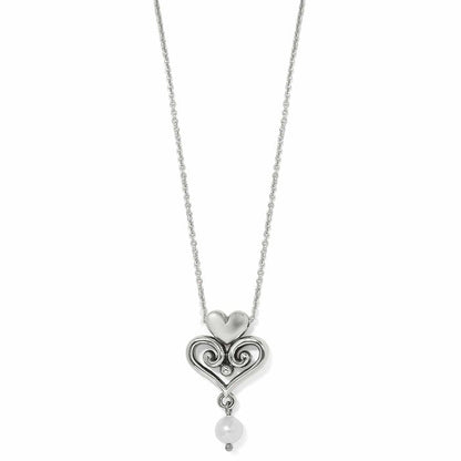 Brighton pendant necklace with silver-plated scrolled heart design and glass pearl drop on a white background