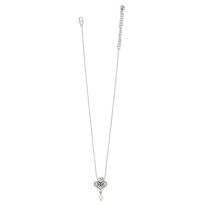Brighton silver-plated pendant necklace with scrolled heart design and glass pearl drop on a white background