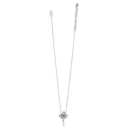 Brighton silver-plated pendant necklace with scrolled heart design and glass pearl drop on a white background