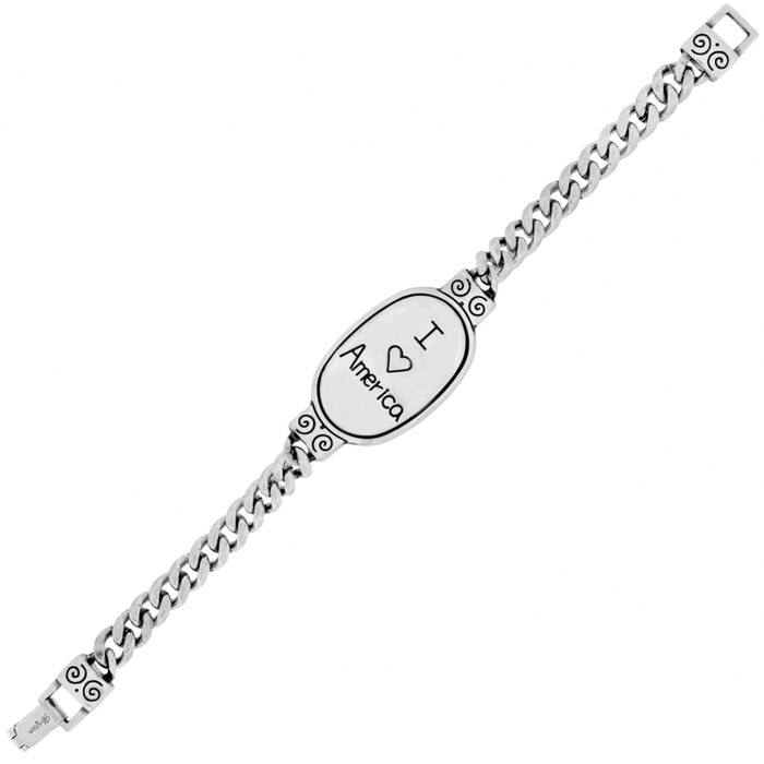 Brighton silver-plated curb chain bracelet with oval I love America engraved plaque and scroll details on a white background
