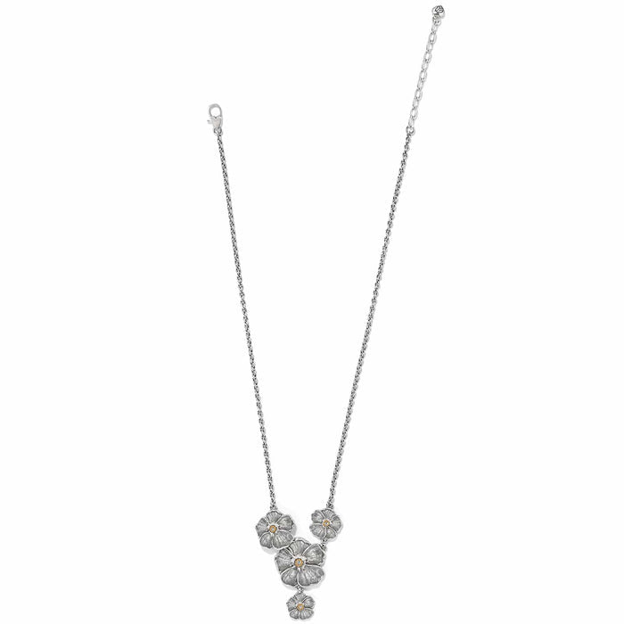 Brighton necklace with silver-tone floral pendants featuring crystal centers and delicate chain on a white background