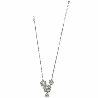 Brighton necklace with silver-tone floral pendants featuring crystal centers and delicate chain on a white background