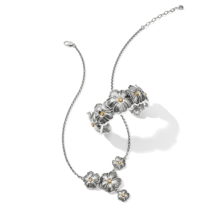 Brighton silver-tone floral necklace and matching cuff bracelet with crystal centers styled together on a white background