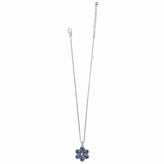 Brighton pendant necklace with silver-plated chain and blue crystal flower charm on a white background