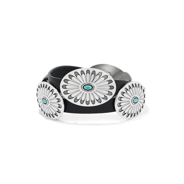 Brighton black leather belt with oval silver-tone concho medallions and turquoise stone centers on a white background