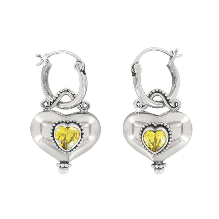 Brighton hoop earrings with sterling silver heart drops and yellow crystal centers with beaded detail on a white background