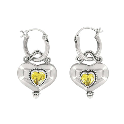 Brighton hoop earrings with sterling silver heart drops and yellow crystal centers with beaded detail on a white background