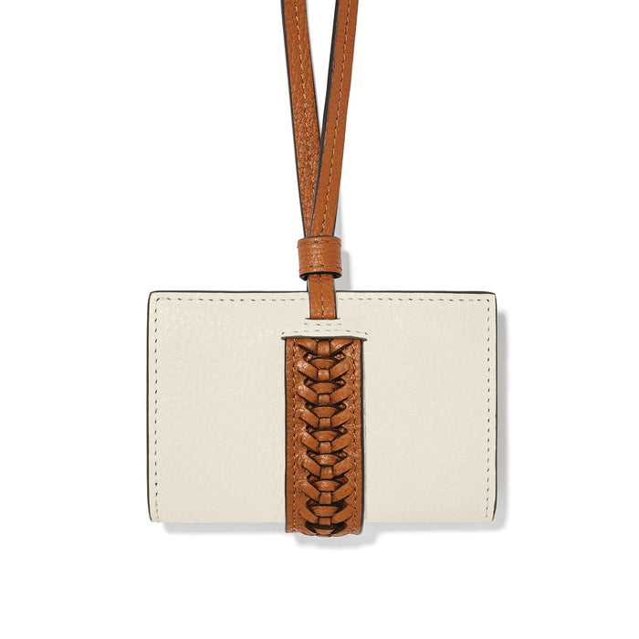 Brighton cream leather card case with tan braided leather closure strap and shoulder cord on a white background