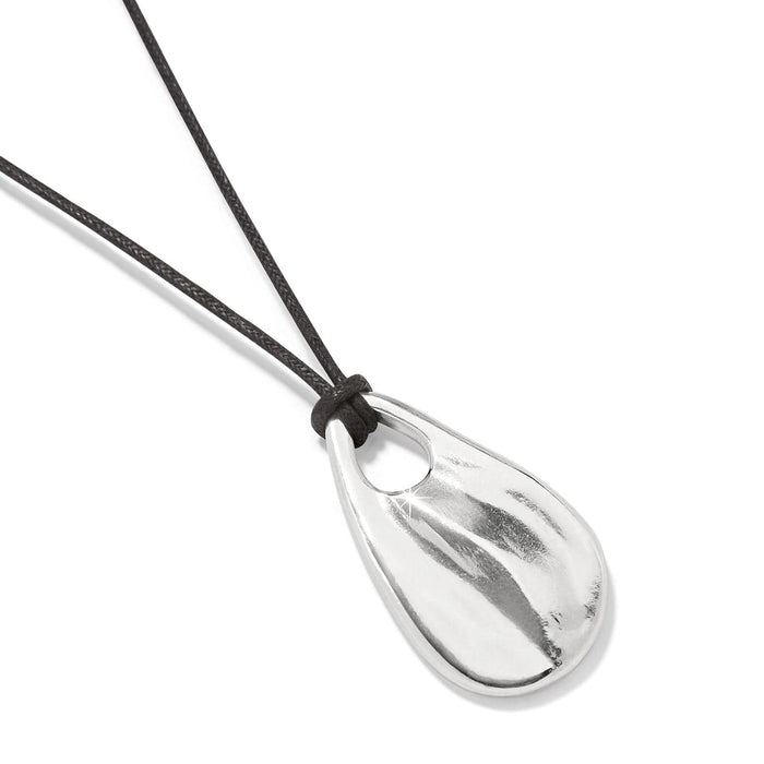 Brighton pendant necklace with silver-plated teardrop pendant on black cord with knotted detail on a white background