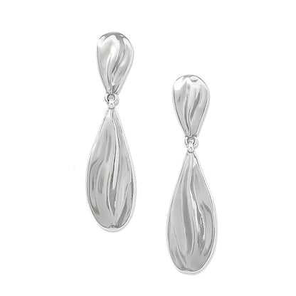 Brighton drop earrings with elongated silver-plated teardrop shapes and sculpted swirl texture on a white background