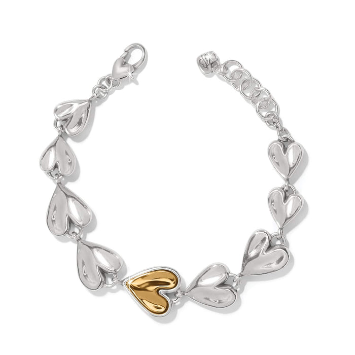 Brighton heart link bracelet in two-tone finish with silver hearts and a central gold heart on a white background