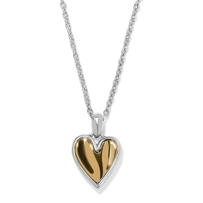 Brighton pendant necklace with two-tone heart pendant in gold and silver on a white background