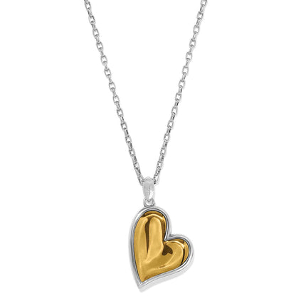 Brighton pendant necklace with two-tone gold heart and silver-tone frame on a delicate chain on a white background