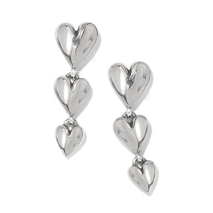 Brighton drop earrings with three graduated polished silver-tone heart charms cascading on a white background