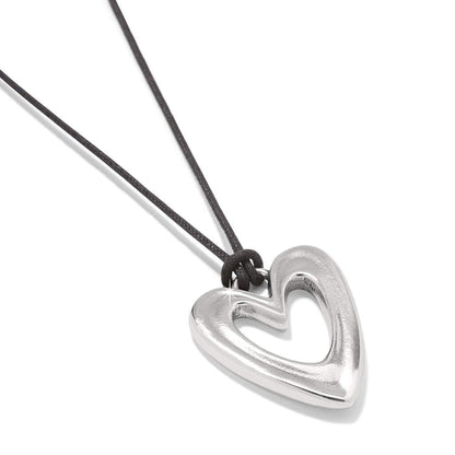 Brighton pendant necklace with silver-plated open heart pendant on a black cord on a white background