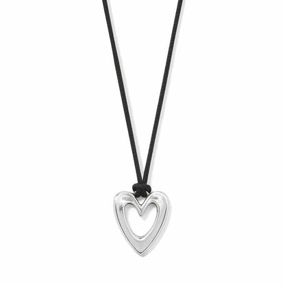 Brighton pendant necklace with silver-plated open heart on black cord with knot detail on a white background