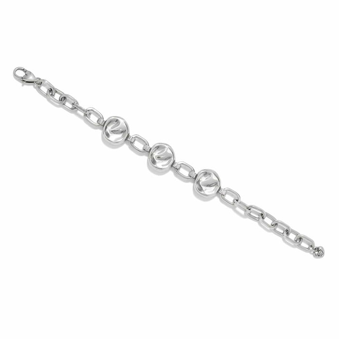 Brighton chain bracelet with three polished silver-tone disc stations and oval link chain on a white background