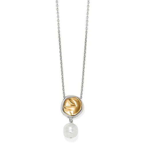 Brighton pendant necklace with two-tone silver and gold medallion and baroque glass pearl drop on a white background
