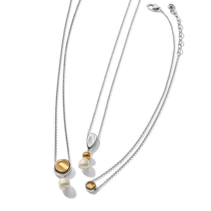 Brighton two-tone layered necklace with barque glass pearl and gold-tone pendants on a white background