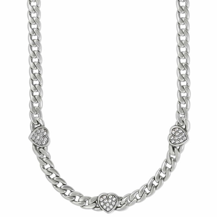 Brighton silver-plated curb chain necklace with three crystal-set heart stations on a white background