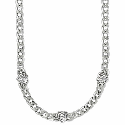 Brighton silver-plated curb chain necklace with three crystal-set heart stations on a white background