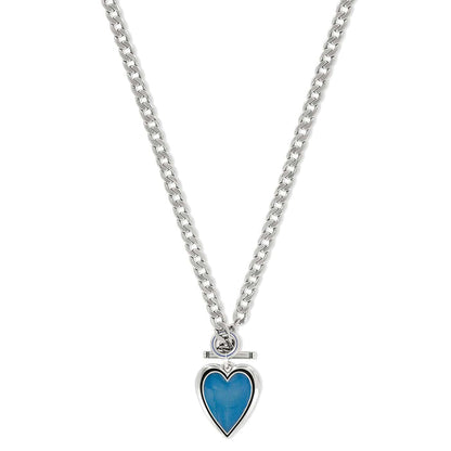 Brighton pendant necklace with blue enamel heart, silver-plated curb chain, and toggle closure on a white background