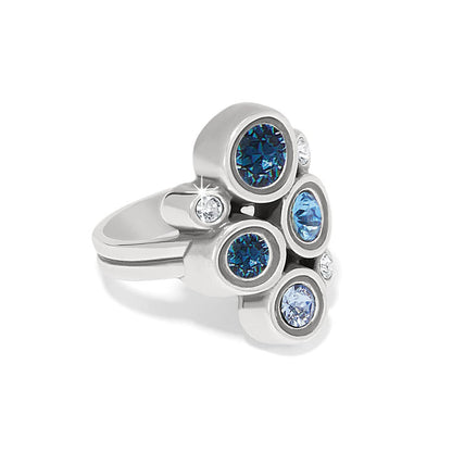 Brighton silver-plated ring with cluster of blue and clear fine quality crystals in bezel settings on a white background
