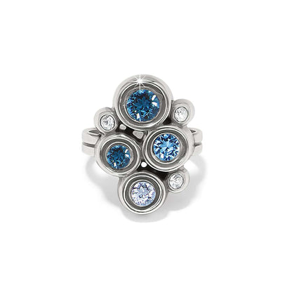 Brighton silver-plated ring with clustered blue and clear fine quality crystals in bezel settings on a white background
