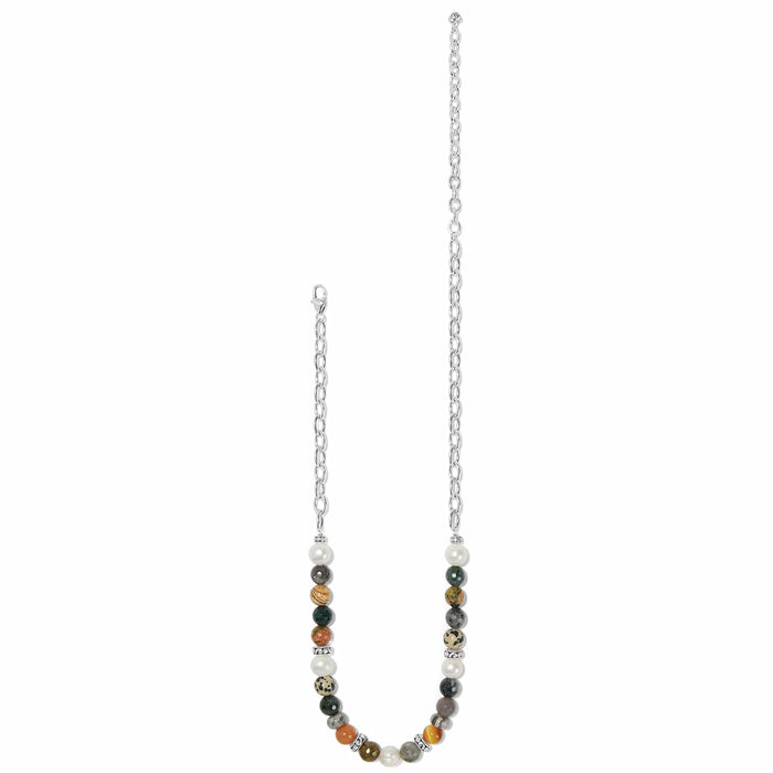 Brighton beaded necklace with multicolor stones, glass pearls, and silver-plated chain and accents on a white background