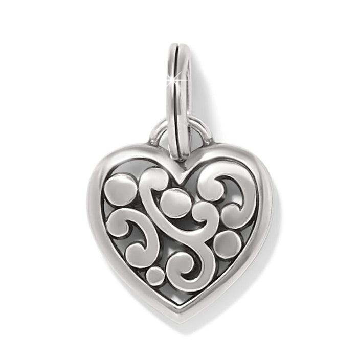 Brighton heart charm with silver-tone scroll and dot openwork design and split ring on a white background